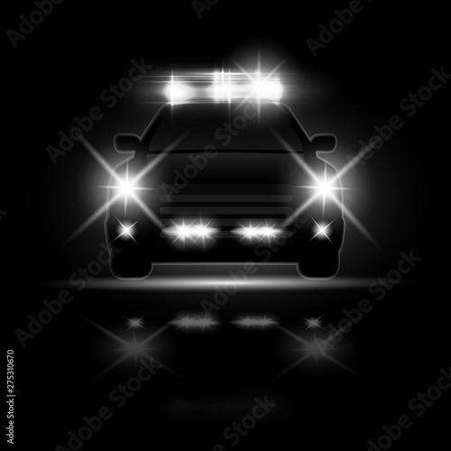 Police car with headlights flares and siren at the night road. Special light beams