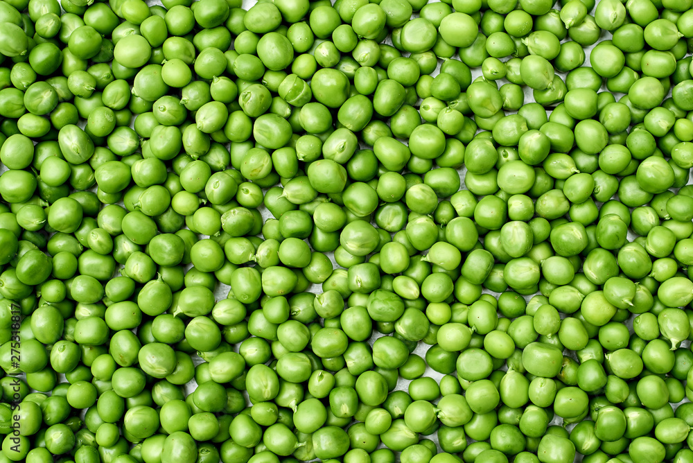Fresh green peas texture background, copy space. Top view, above