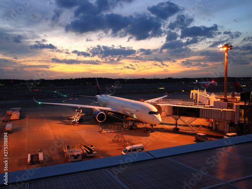 Narita aiport with airplane ready to takeoff at sunset