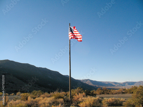 USA flag near Mono Lake Natural Reserve, California. Flag post near the Mono Lake in Sierra Nevada