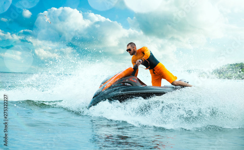 Fotografía Young Man on water scooter, Tropical Ocean, Vacation Concept