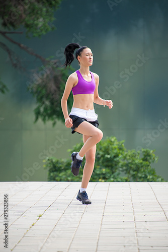 Fitness girl exercising outdoor in urban city architecture, stretching legs, doing squash, push-buttons, jumps, resting, smiling athlete body © oreans