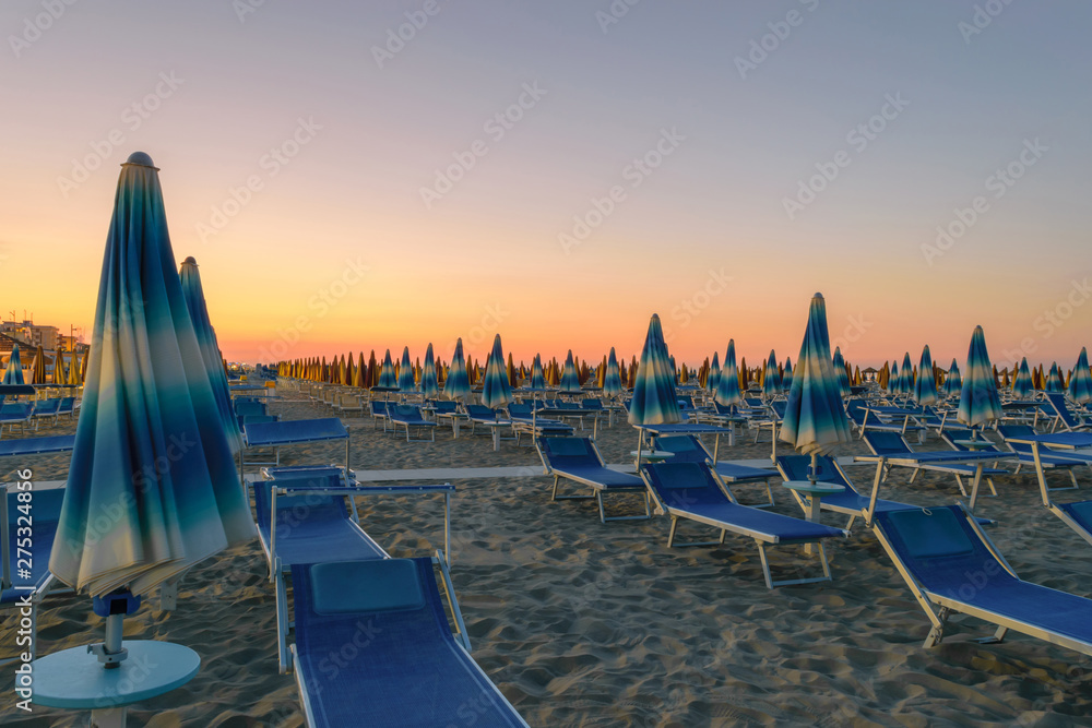 Parasols and sunbeds in Rimini resort beach