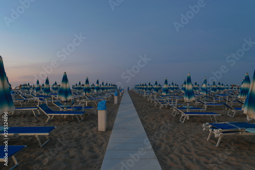 Parasols and sunbeds in Rimini resort beach