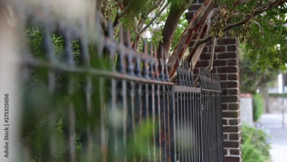 Dreamy Landscape look, Metal Forged Fence near the apartment building. Follow the focus. Dreamy Landscape look, Metal Forged Fence near the apartment building. Follow the focus.