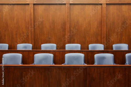 Empty chairs in jury box photo