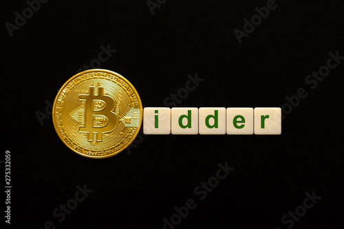 Word Bidder made up of cubes. The first letter of the word is symbolized by a bitcoin coin. Concept of strong BTC, bitcoin growth rate, price increase, blockchain confidence, positive price outlook. photo