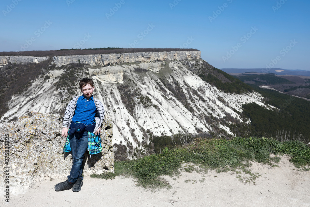 Child on Crimean Mountains background