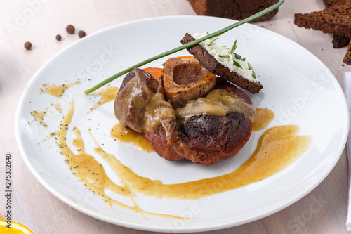 osso buco with citrus sauce on plate