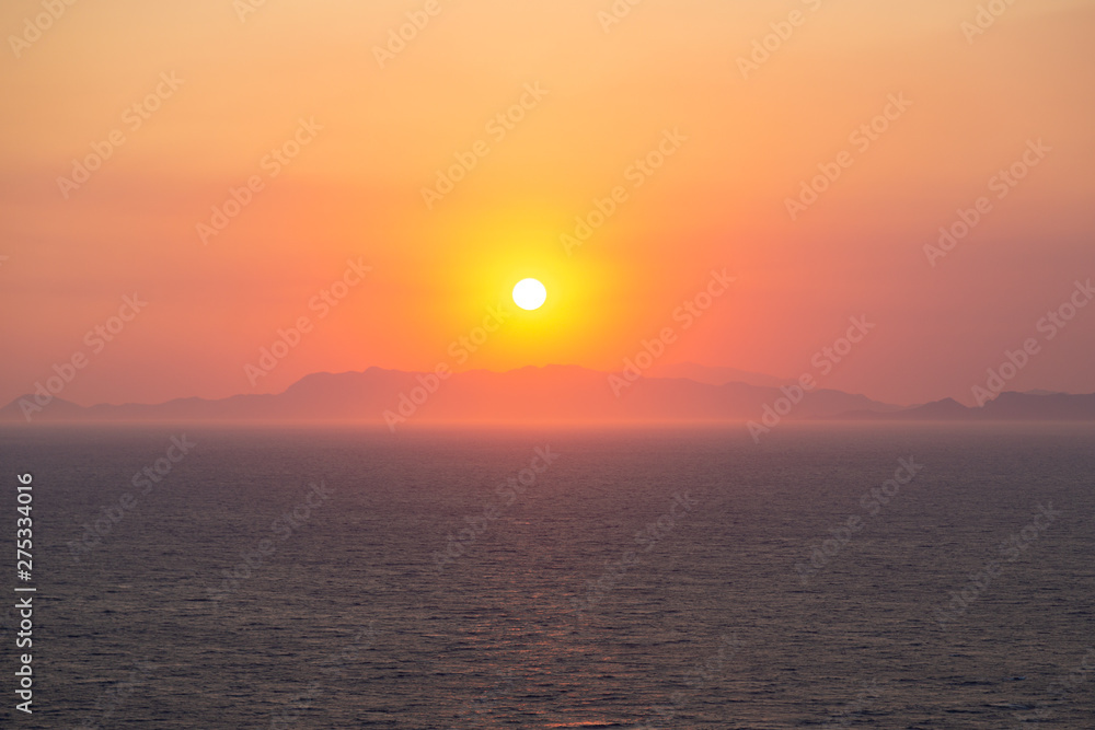 Dramatic sunset over the mountains and the sea. Greece, Rhodos 