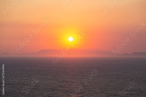 Dramatic sunset over the mountains and the sea. Greece, Rhodos 