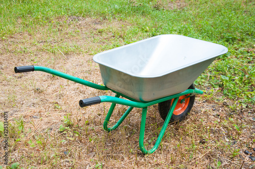 hand truck on one wheel. Garden or construction. Green Summer