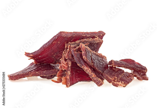 Quadro su tela Portion of beef jerky on a white white background