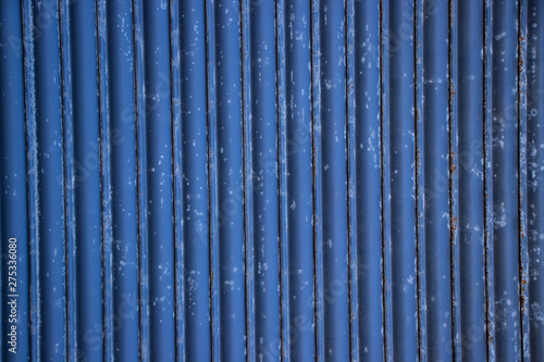 Blue painted worn corrugated metal texture background