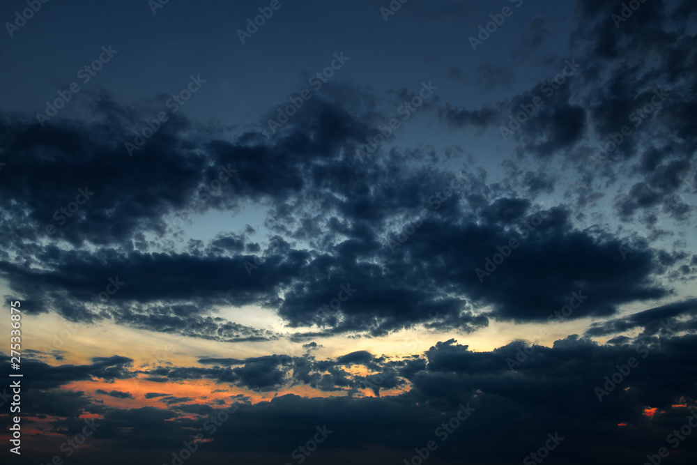 Fototapeta premium Dark sky with clouds at sunset