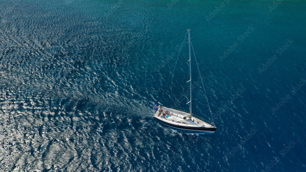 Fototapeta premium Aerial photo of beautiful wooden deck sail boat cruising the Aegean blue sea, Greece