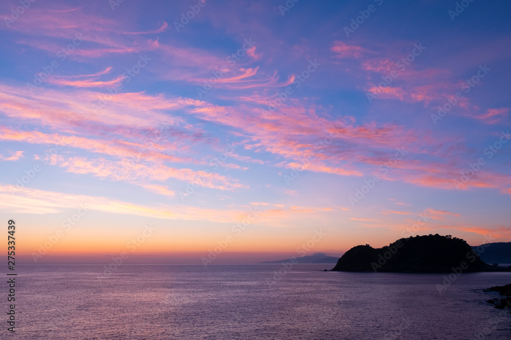 red sky at sunrise in Getaria, Euskadi coast, Spain