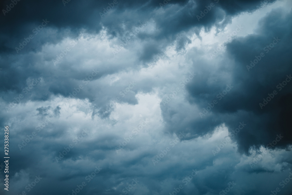 Dramatic cloudscape texture. Dark heavy thunderstorm clouds before rain. Overcast rainy bad weather. Storm warning. Natural blue background of cumulonimbus. Nature backdrop of stormy cloudy sky.