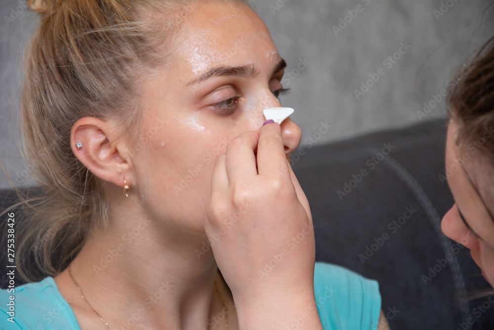 Spa Woman applying Facial clay Mask. Beauty Treatments.facial cleansing, cosmetology, beauty mask Spa Woman applying Facial clay Mask. Beauty Treatments.facial cleansing, cosmetology, beauty mask