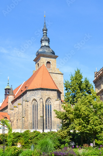 Vertical picture of historical Franciscan Monastery in Plzen, Czech Republic shot from the park in Krizikovy sady. Medieval architecture, attraction. Pilsen, Western Bohemia, Czechia. Sunny day