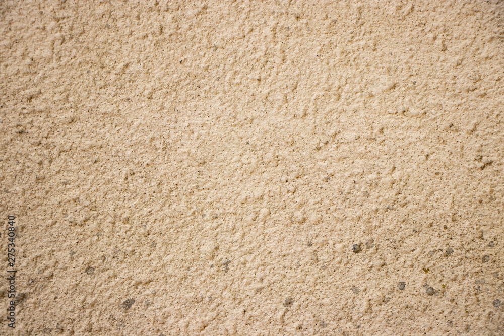 Beige painted grunge wall rough texture Beige painted grunge wall rough texture