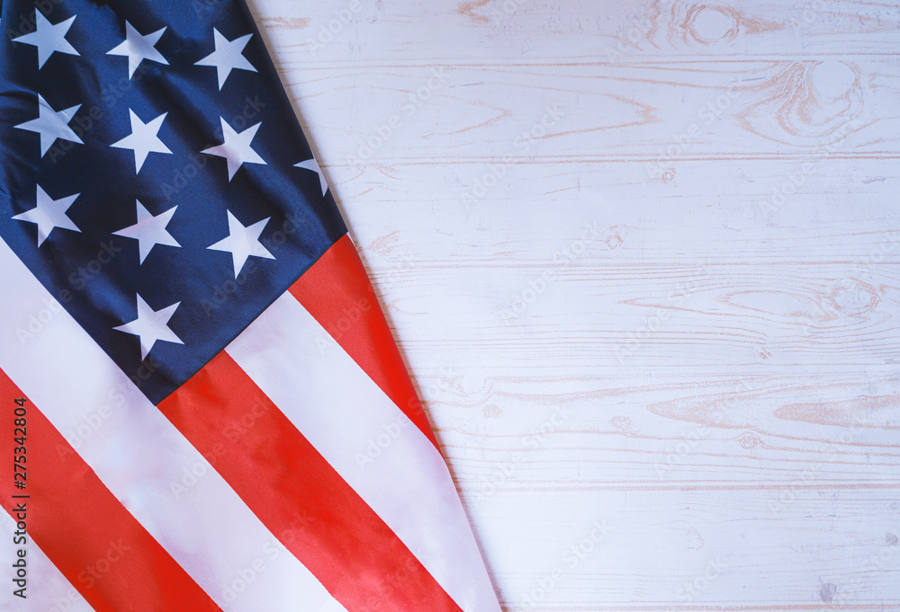 Obraz premium Flag of United States of America on white wooden background. 4th of july, independence concept.jpg