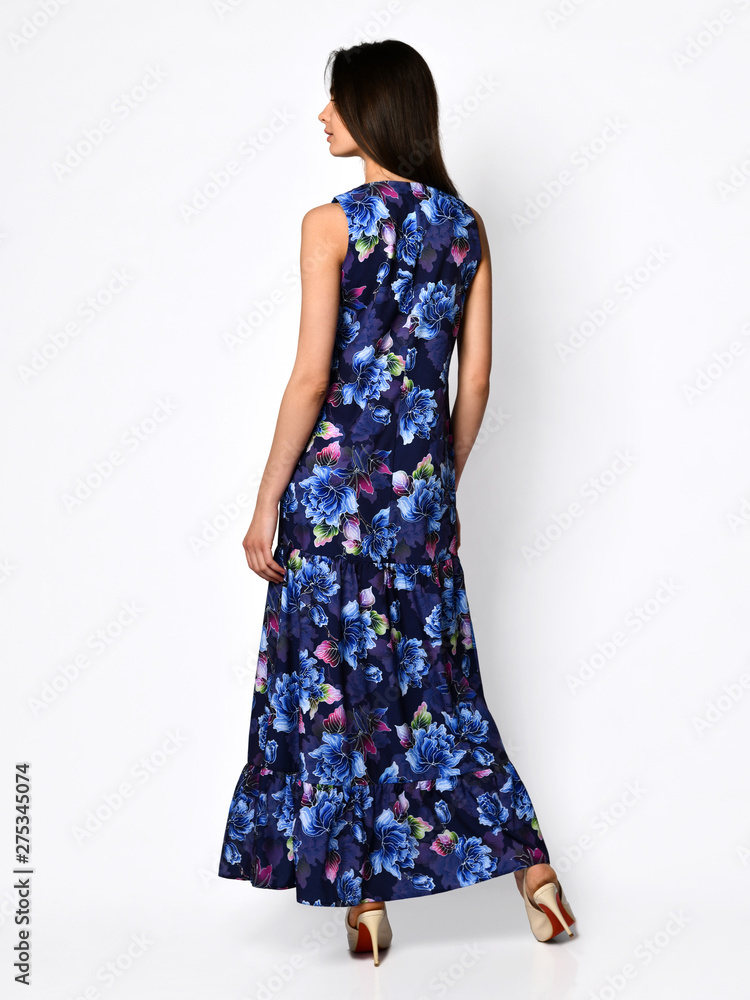 Young beautiful woman walking in new design casual summer long dress full body on white Young beautiful woman walking in new design casual summer long dress full body on white