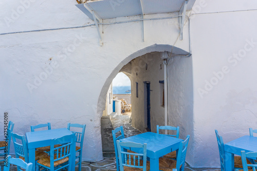 Street view of Chorio with paved alleys and traditional cycladic architecture in Kimolos island in Cyclades, Greece © Haris Andronos