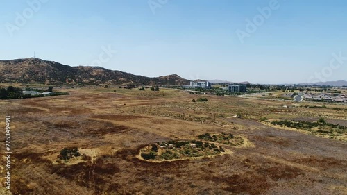 Tilt down aerial, rural field in Murrieta
