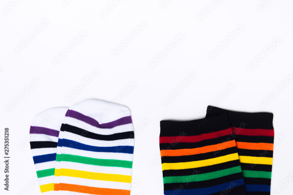 Two clean white and black pair of socks with striped pattern on white background with copy space Two clean white and black pair of socks with striped pattern on white background with copy space