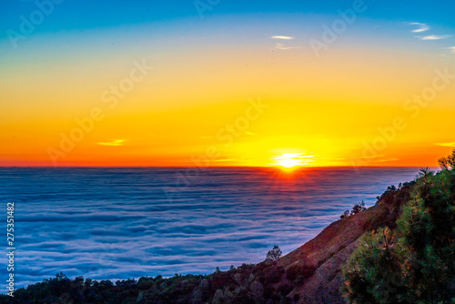 Sun on Horizon of Sea of Clouds, Mountain