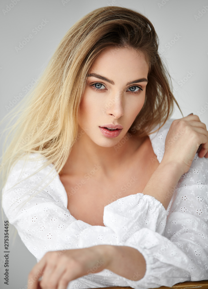Fashion portrait of blonde girl isolated on gray background Fashion portrait of blonde girl isolated on gray background