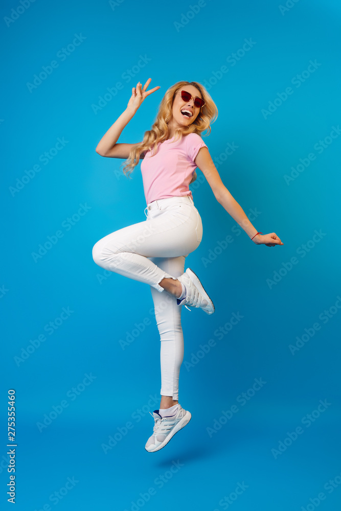 Happy Woman Jumping and Having Fun in Studio