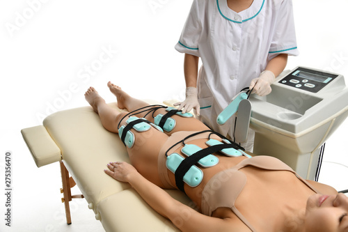 Картината върху платно Doctor make anti cellulite and fat therapy massage for woman on buttocks