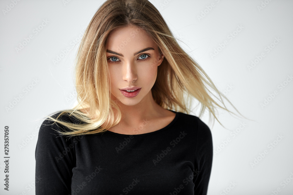 Fototapeta premium Portrait of beautiful blonde woman isolated on white background