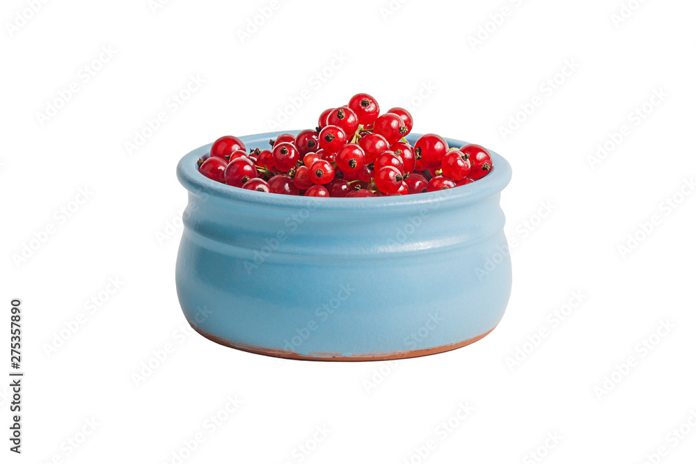 fresh red currants in a clay bowl on a white isolated background fresh red currants in a clay bowl on a white isolated background