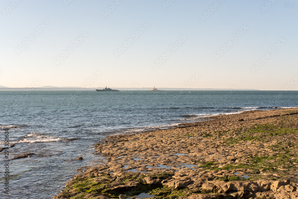 The Bugio Lighthouse and a vassal at Tagus Estuary in the morning.
