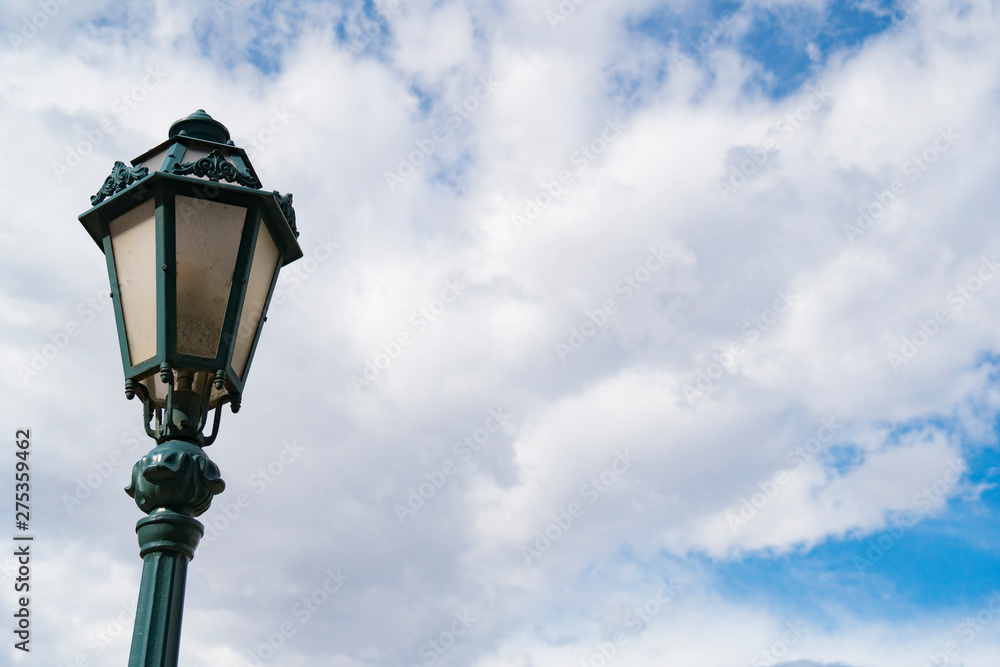 Lamp Post in a Blue Sky with White CLouds