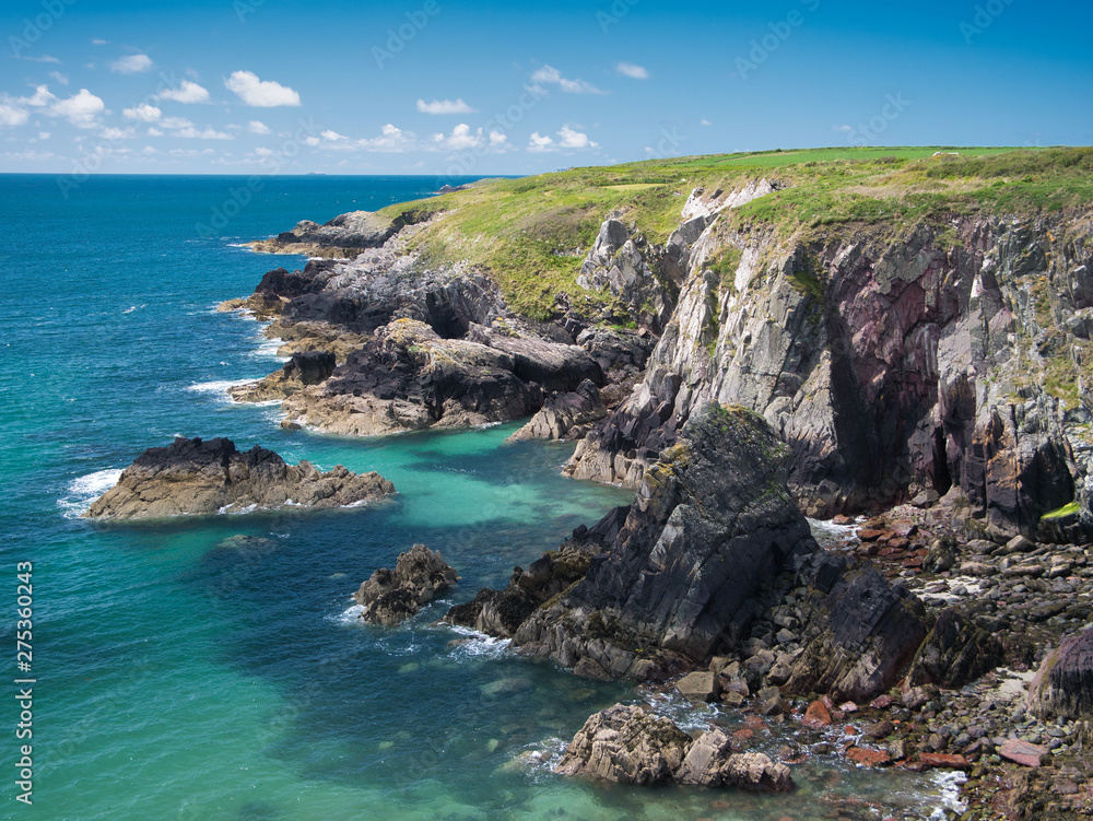 Coastal cliffs in Pembrokeshire, South Wales, UK, as viewed from the Coast Path Coastal cliffs in Pembrokeshire, South Wales, UK, as viewed from the Coast Path