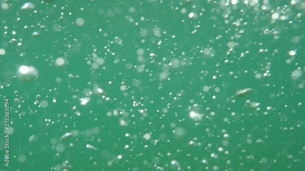 Bubbles rising to the surface. Slow motion. Air bubbles in clear blue water (underwater shot), good for backgrounds. Bubbles rising to the surface. Slow motion. Air bubbles in clear blue water (underwater shot), good for backgrounds.