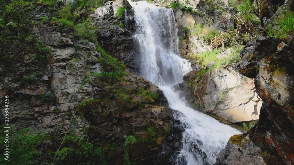 Waterfall in the Altai mountains. Beautiful nature summer landscape. Waterfall in the Altai mountains. Beautiful nature summer landscape.