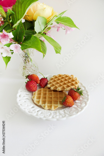 Waffles with Strawberries in a Plate isolated on a White Background