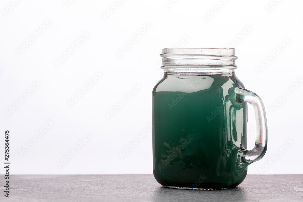 Green Spirulina Smoothie - Concept of food and drink, diet and nutrition - Text space Green Spirulina Smoothie - Concept of food and drink, diet and nutrition - Text space