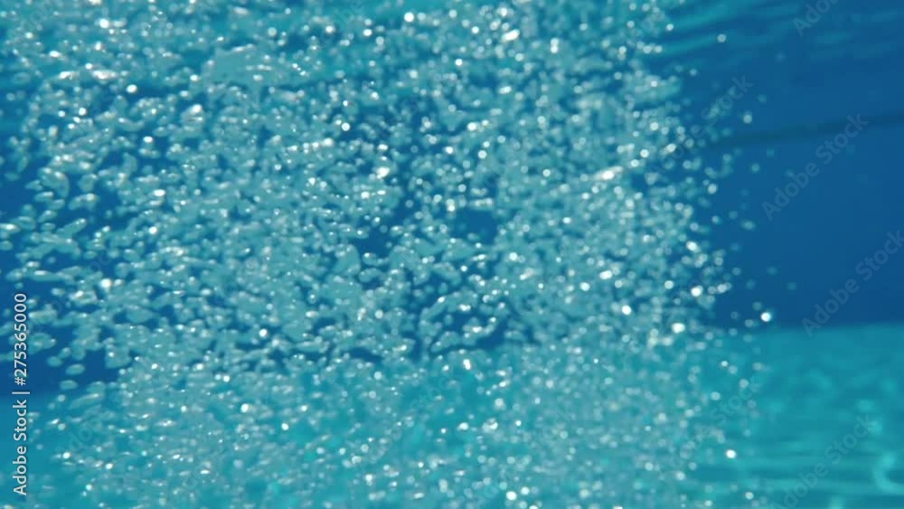 Bubbles rising to the surface. Slow motion. Air bubbles in clear blue water (underwater shot), good for backgrounds. Bubbles rising to the surface. Slow motion. Air bubbles in clear blue water (underwater shot), good for backgrounds.