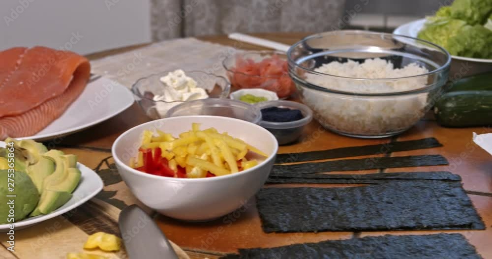 Ingerdients of sushi lying on table. Camera moving from left to right side. Ingerdients of sushi lying on table. Camera moving from left to right side.