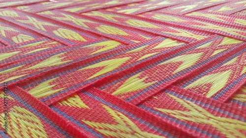 Closeup view of colorful plastic woven stripes.