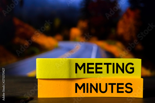 Meeting Minutes on the sticky notes with bokeh background