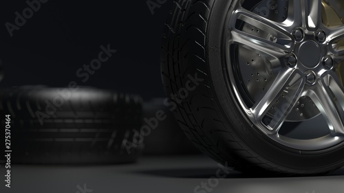  tire auto on a dark background. Alloy wheels. 3d render