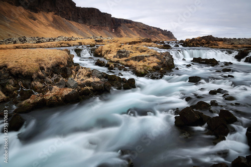 Beautiful scenery of rapids and small waterfalls on the Fossalar river cascade near Vatnajokull national park on Ring road in southern Iceland. Fossalar river is the famous natural landmark and touris