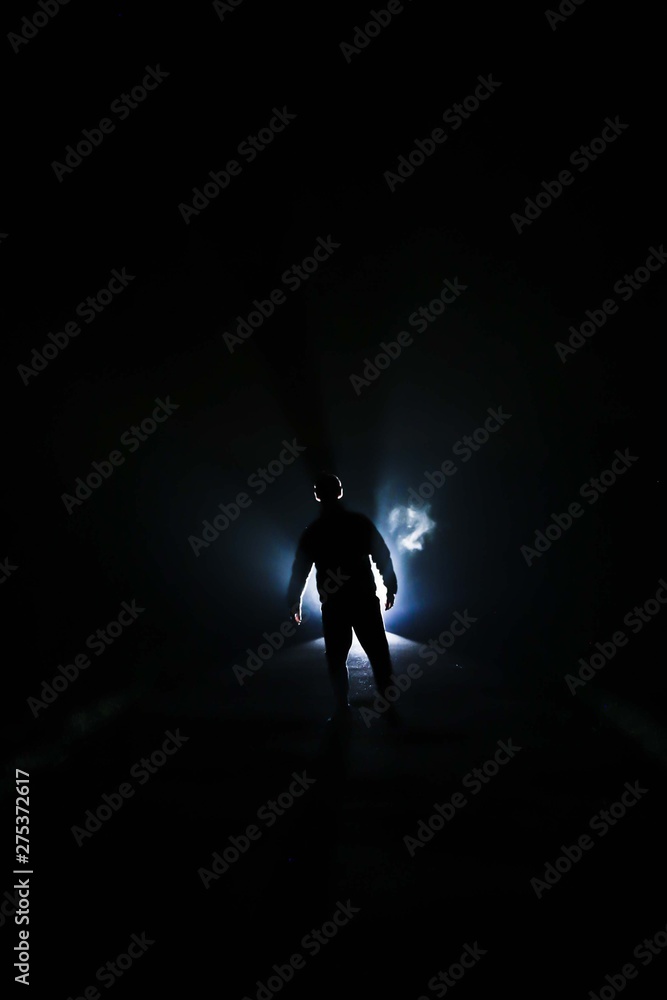 silhouette of a man with light backlight